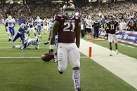 Dec 31, 2013; Atlanta, GA, USA; Texas A&M Aggies running back Tra Carson (21) scores a touchdown in the third quarter past Duke Blue Devils cornerback DeVon Edwards (27) safety Jeremy Cash (16) in the 2013 Chick-fil-a Bowl at the Georgia Dome. Mandatory C
