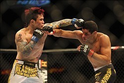February 4, 2012; Las Vegas, NV, USA; UFC fighter Renan Barao (right) fights against Scott Jorgensen (left) during UFC 143 at the Mandalay Bay Events Center. Barao defeats Jorgensen. Mandatory Credit: Kelvin Kuo-USA TODAY Sports