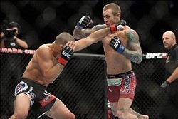 Sep 21, 2013; Toronto, Ontario, CAN; Renan Barao (left) fights Eddie Wineland during their interim bantamweight championship bout at UFC 165 at the Air Canada Centre. Mandatory Credit: Tom Szczerbowski-USA TODAY Sports