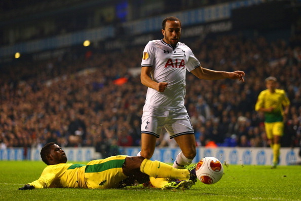 LONDON, ENGLAND - DECEMBER 12:  Abdul Razak of Anzhi Makhachkala tackles Andros Townsend of Tottenham Hotspur during the UEFA Europa League Group K match between Tottenham Hotspur FC and FC Anji Makhachkala at White Hart Lane on December 12, 2013 in Londo