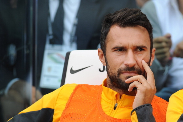 TURIN, ITALY - SEPTEMBER 22:  Mirko Vucinic of Juventus sits on the stand prior to the Serie A match between Juventus and Hellas Verona FC at Juventus Arena on September 22, 2013 in Turin, Italy.  (Photo by Valerio Pennicino/Getty Images)