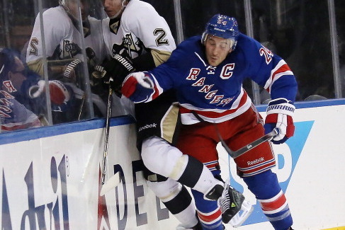 NEW YORK, NY - NOVEMBER 06: Ryan Callahan #24 of the New York Rangers hits Matt Niskanen #2 of the Pittsburgh Penguins into the boards during the third period at Madison Square Garden on November 6, 2013 in New York City. The Rangers defeated the Penguins