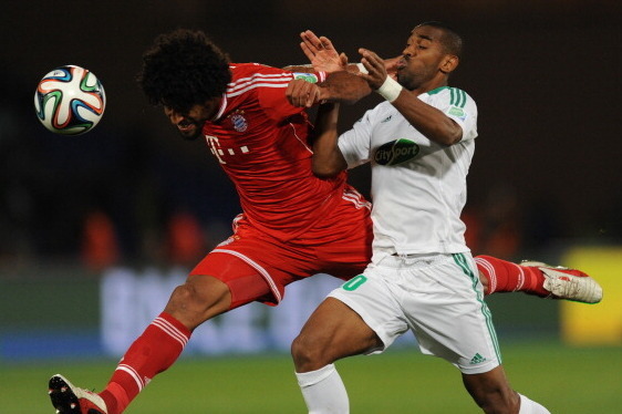 MARRAKECH, MOROCCO - DECEMBER 21: Dante of FC Bayern Munchen wins a header from Mouhssine Iajour of Raja Casablanca during the FIFA Club World Cup Final match between FC Bayern Munchen v Raja Casablanca at Marrakech Stadium on December 21, 2013 in Marrake