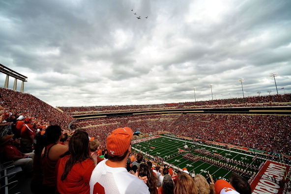 AUSTIN, TX - NOVEMBER 16:  A military flyover prior to a game between the Oklahoma State Cowboys and the Texas Longhorns at Darrell K Royal-Texas Memorial Stadium on November 16, 2013 in Austin, Texas.  (Photo by Stacy Revere/Getty Images)