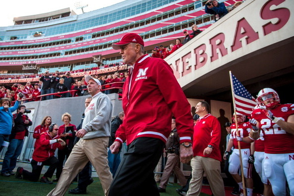 LINCOLN, NE - NOVEMBER 17: Retiring Athletic Director and former coach Tom Osborne, along side Nebraska Cornhuskers head coach Bo Pelini, lead the team onto the field to face the Minnesota Golden Gophers before their game at Memorial Stadium on November 1