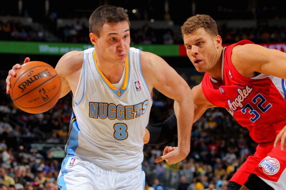 DENVER, CO - MARCH 07:  Danilo Gallinari #8 of the Denver Nuggets controls the ball against Blake Griffin #32 of the Los Angeles Clippers at the Pepsi Center on March 7, 2013 in Denver, Colorado. The Nuggets defeated the Clippers 107-92. NOTE TO USER: Use