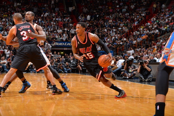 MIAMI, FL - JANUARY 29: Mario Chalmers #15 of the Miami Heat dribbles the ball against the Oklahoma City Thunder at the American Airlines Arena in Miami, Florida on Jan. 29, 2014. NOTE TO USER: User expressly acknowledges and agrees that, by downloading a
