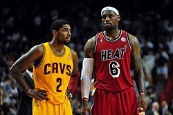 Feb 24, 2013; Miami, FL, USA; Cleveland Cavaliers point guard Kyrie Irving (2) and Miami Heat small forward LeBron James (6) during the second half at the American Airlines Arena.  MIami won 109-105. Mandatory Credit: Steve Mitchell-USA TODAY Sports