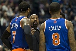 Dec 18, 2013; Milwaukee, WI, USA; New York Knicks head coach Mike Woodson talks to forward Carmelo Anthony (7) and guard J.R. Smith (8) during the first overtime period against the Milwaukee Bucks at BMO Harris Bradley Center.  New York won 107-101 in dou