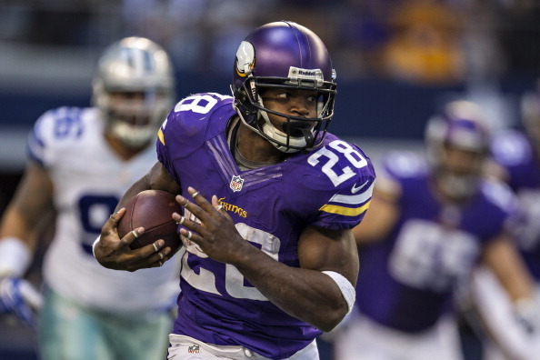 ARLINGTON, TX - NOVEMBER 3:  Adrian Peterson #28 of the Minnesota Vikings runs the ball against the Dallas Cowboys at  AT&T Stadium on November 3, 2013 in Arlington, Texas.  The Cowboys defeated the Vikings 27-23.  (Photo by Wesley Hitt/Getty Images)