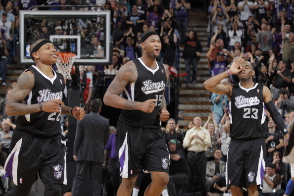 SACRAMENTO, CA - APRIL 17: Isaiah Thomas #22, DeMarcus Cousins #15 and Marcus Thornton #23 of the Sacramento Kings celebrate during the game against the Los Angeles Clippers on April 17, 2013 at Sleep Train Arena in Sacramento, California. NOTE TO USER: U