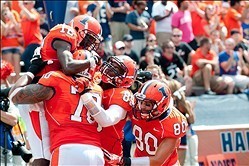 Sep 7, 2013; Champaign, IL, USA; Illinois Fighting Illini offensive linesman Corey Lewis (70) and Illinois Fighting Illini tight end Evan Wilson (89) and Illinois Fighting Illini wide receiver Spencer Harris (80) celebrate with Illinois Fighting Illini wi