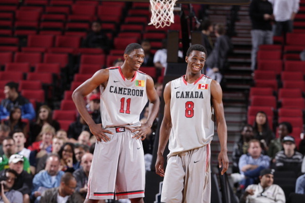 PORTLAND, OR - APRIL 20:  Joel Embiid #11 and Andrew Wiggins #8 of the World Select Team smile during the game against the USA Junior Select Team at the 2013 Nike Hoop Summit game on April 20, 2013 at the Rose Garden Arena in Portland, Oregon. NOTE TO USE