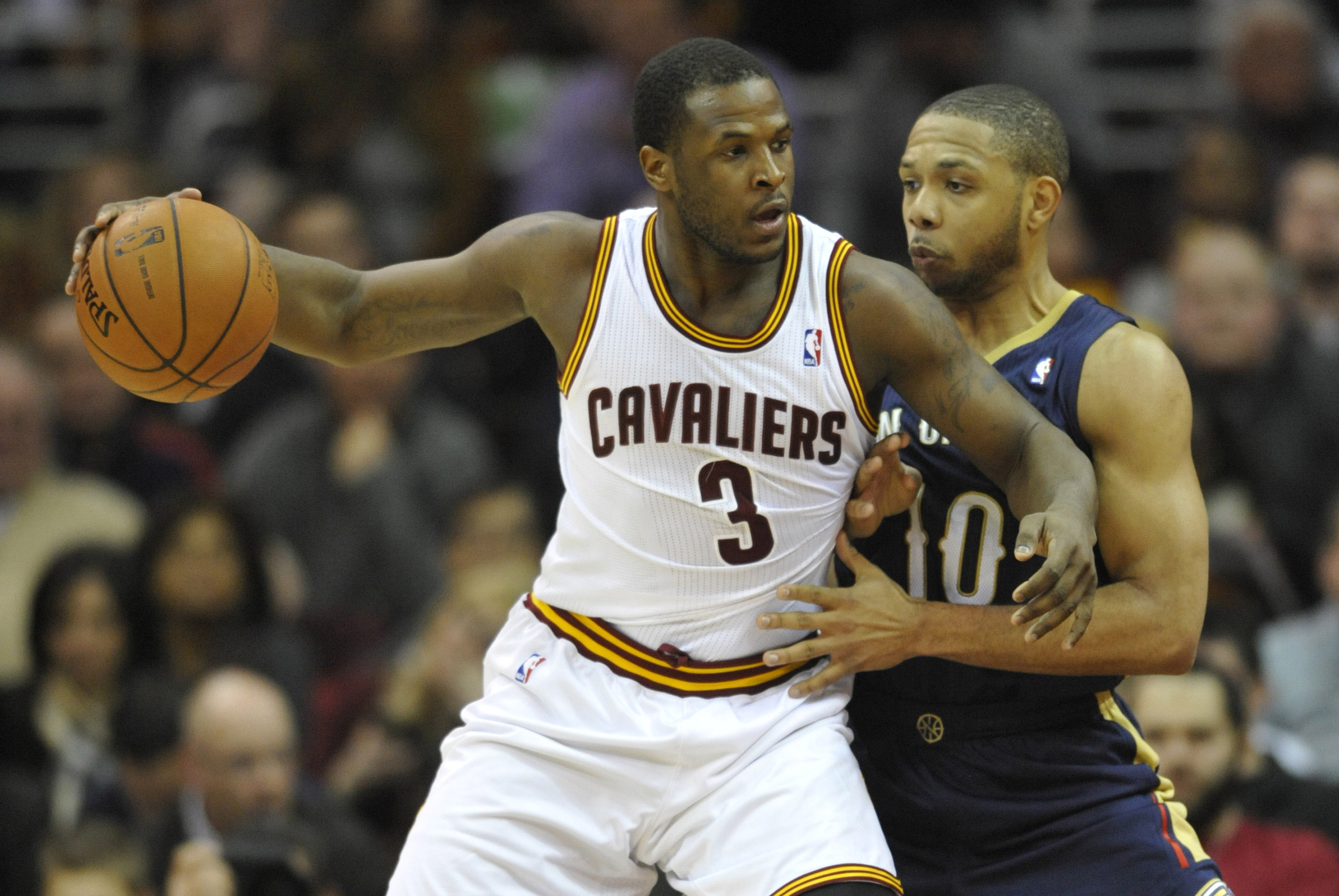 Jan 28, 2014; Cleveland, OH, USA; Cleveland Cavaliers shooting guard Dion Waiters (3) dribbles against New Orleans Pelicans shooting guard Eric Gordon in the third quarter at Quicken Loans Arena. Mandatory Credit: David Richard-USA TODAY Sports