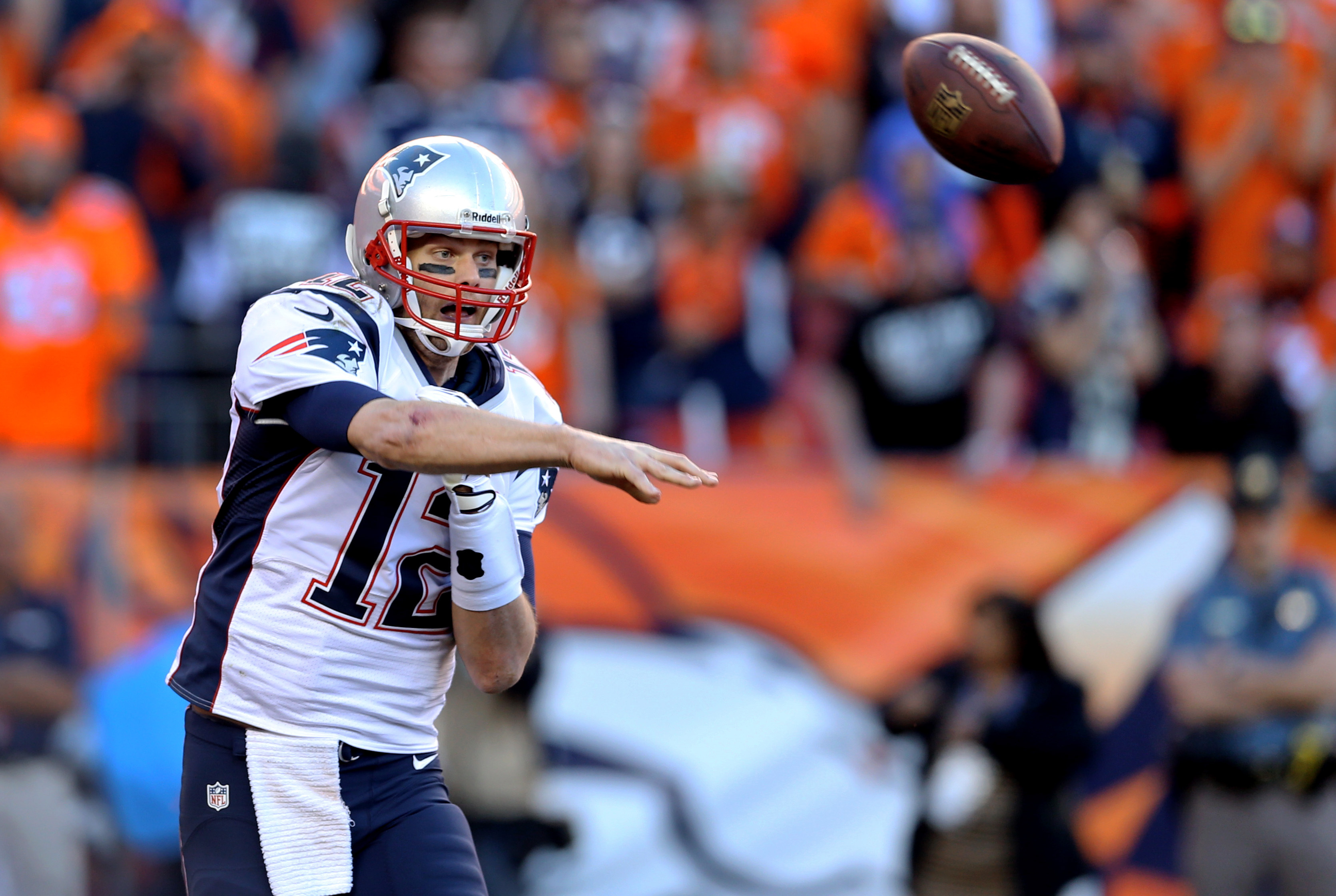 January 19, 2014; Denver, CO, USA; New England Patriots quarterback Tom Brady (12) against the Denver Broncos in the 2013 AFC Championship football game at Sports Authority Field at Mile High. Mandatory Credit: Mark J. Rebilas-USA TODAY Sports