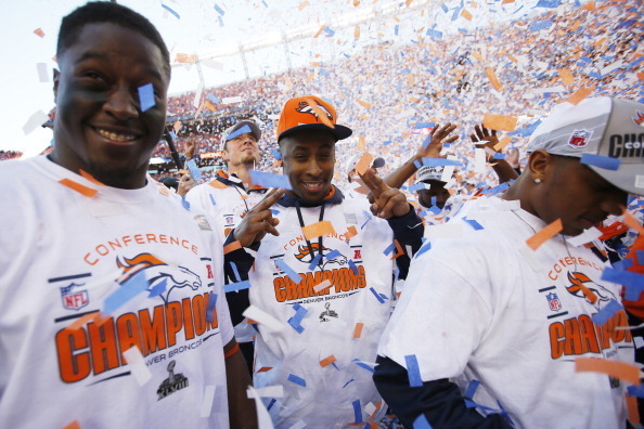 DENVER, CO - JANUARY 19:  The Denver Broncos celebrate after they defeated the New England Patriots 26 to 16 during the AFC Championship game at Sports Authority Field at Mile High on January 19, 2014 in Denver, Colorado.  (Photo by Kevin C. Cox/Getty Ima