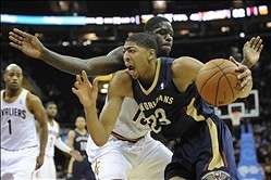 Jan 28, 2014; Cleveland, OH, USA; New Orleans Pelicans power forward Anthony Davis (23) drives against Cleveland Cavaliers small forward Anthony Bennett in the fourth quarter at Quicken Loans Arena. Mandatory Credit: David Richard-USA TODAY Sports