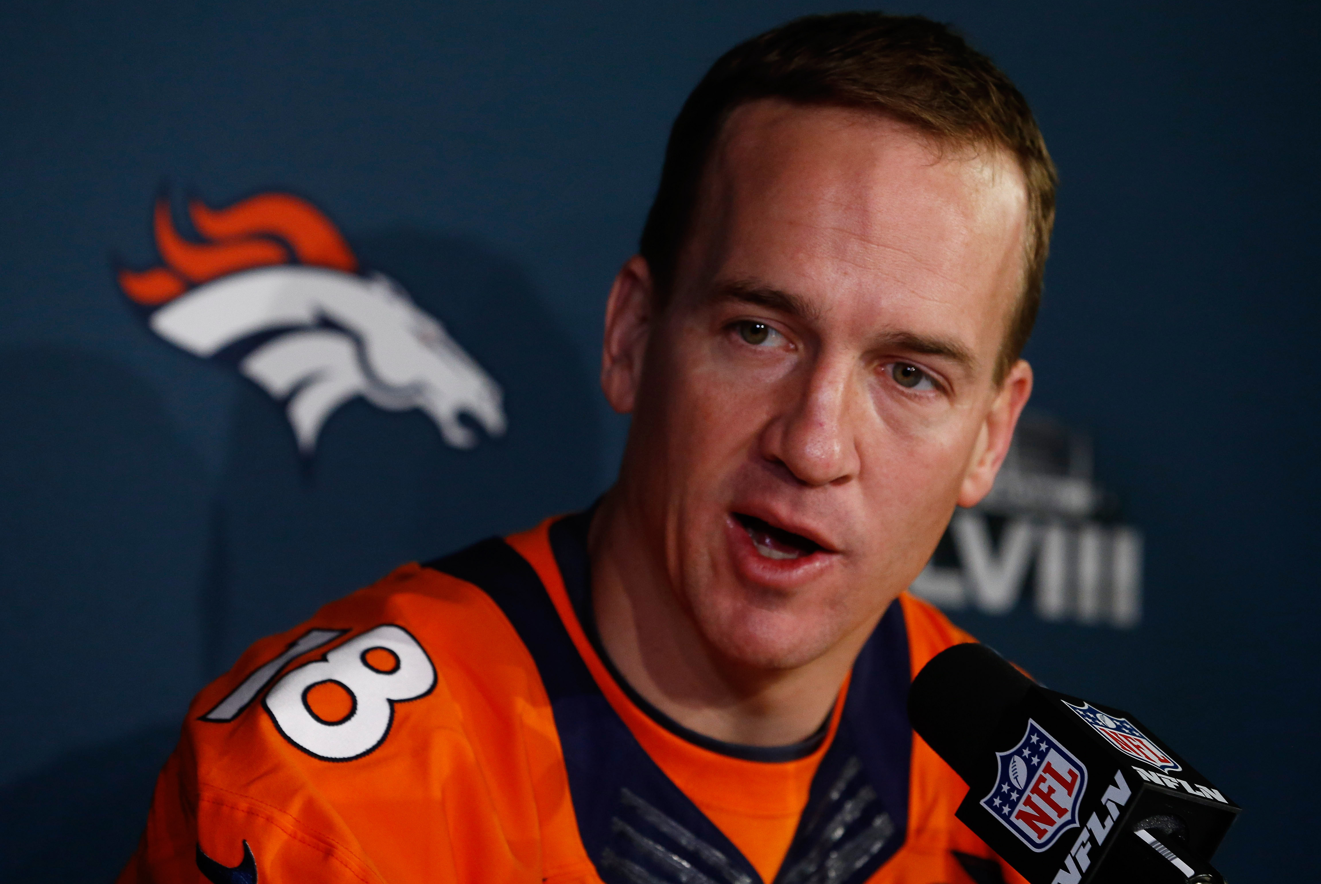 JERSEY CITY, NJ - JANUARY 29:    Peyton Manning #18 of the Denver Broncos speaks to the media during an availability January 29, 2014 in Jersey City, New Jersey. The Denver Broncos and Seattle Seahawks will meet at Super Bowl XLVIII at Metlife Stadium on