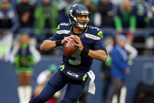 SEATTLE, WA - JANUARY 19:  Quarterback Russell Wilson #3 of the Seattle Seahawks drops back against the San Francisco 49ers during the 2014 NFC Championship at CenturyLink Field on January 19, 2014 in Seattle, Washington.  (Photo by Ronald Martinez/Getty 