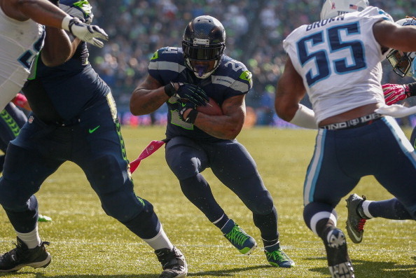 SEATTLE, WA - OCTOBER 13: Running back Marshawn Lynch #24 of the Seattle Seahawks rushes for a touchdown in the second quarter against the Tennessee Titans at CenturyLink Field on October 13, 2013 in Seattle, Washington. (Photo by Otto Greule Jr/Getty Ima