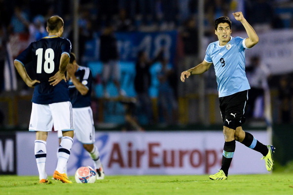 MONTEVIDEO, URUGUAY - OCTOBER 15: Luis Suarez (#9) of Uruguay celebrates a scored goal during a match between Uruguay and Argentina as part of the 18th round of the South American Qualifiers for the FIFA's World Cup Brazil 2014 at Centenario Stadium Stadi