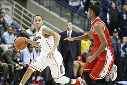 Jan 30, 2014; Storrs, CT, USA; Connecticut Huskies guard Shabazz Napier (13) dribbles the ball in front of Houston Cougars guard L.J. Rose (5) in the second half at Harry A. Gampel Pavilion. UConn won 80-43. Mandatory Credit: David Butler II-USA TODAY Spo