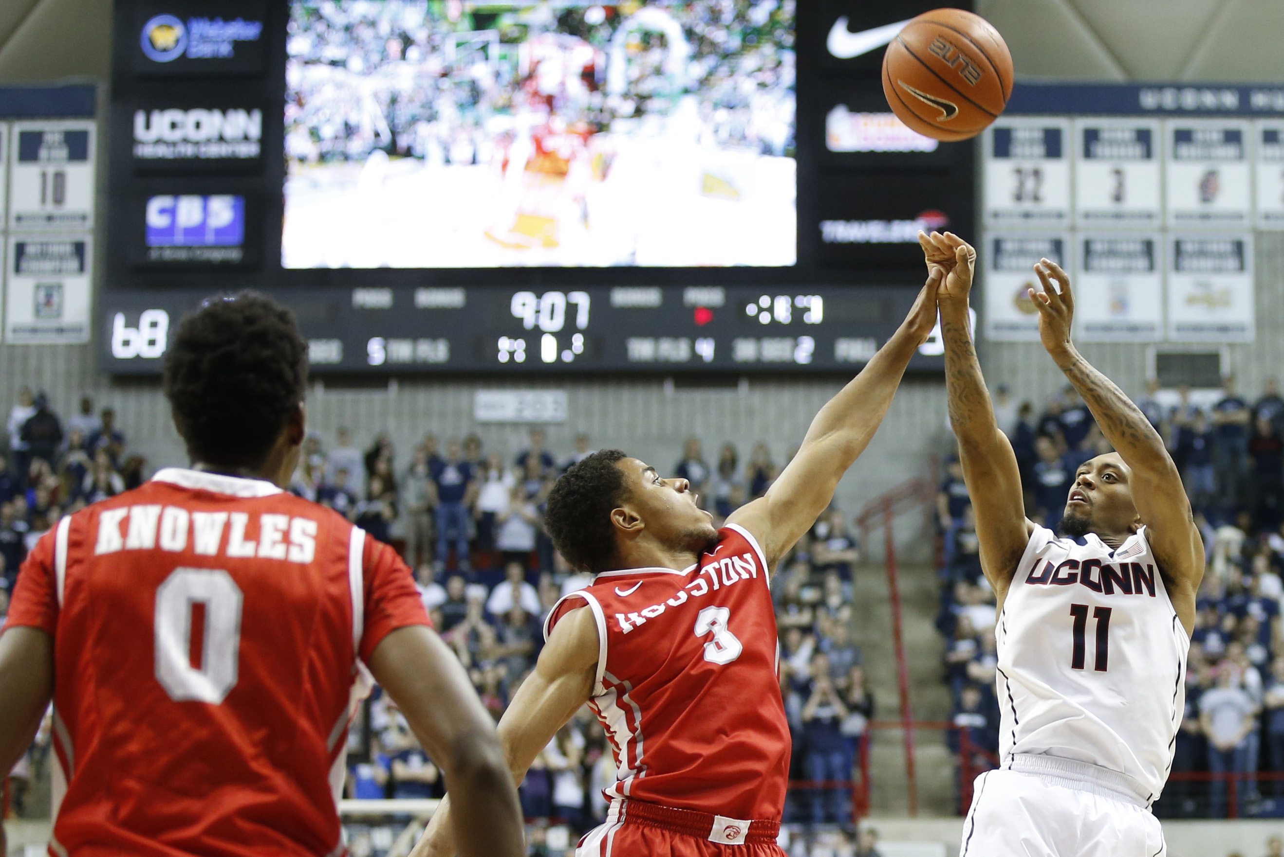 Jan 30, 2014; Storrs, CT, USA; Connecticut Huskies guard Ryan Boatright (11) shoots the ball against Houston Cougars guard Jaaron Simmons (3) in the second half at Harry A. Gampel Pavilion. UConn defeated Houston 80-43. Mandatory Credit: David Butler II-U