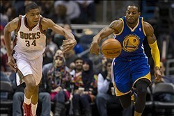 Jan 7, 2014; Milwaukee, WI, USA; Milwaukee Bucks guard Giannis Antetokounmpo (34) and Golden State Warriors forward Andre Iguodala (9) battle for the ball during the third quarter at BMO Harris Bradley Center. Mandatory Credit: Jeff Hanisch-USA TODAY Spor