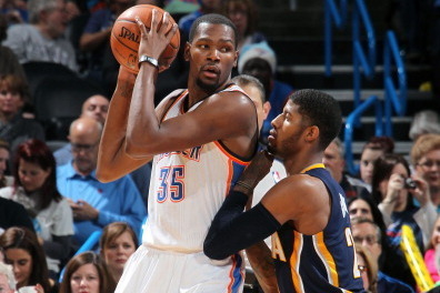 OKLAHOMA CITY, OK - DECEMBER 08:  Kevin Durant #35 of the Oklahoma City Thunder handles the ball against Paul George #24 of the Indiana Pacers during an NBA game on December 8, 2013 at the Chesapeake Energy Arena in Oklahoma City, Oklahoma. NOTE TO USER: 