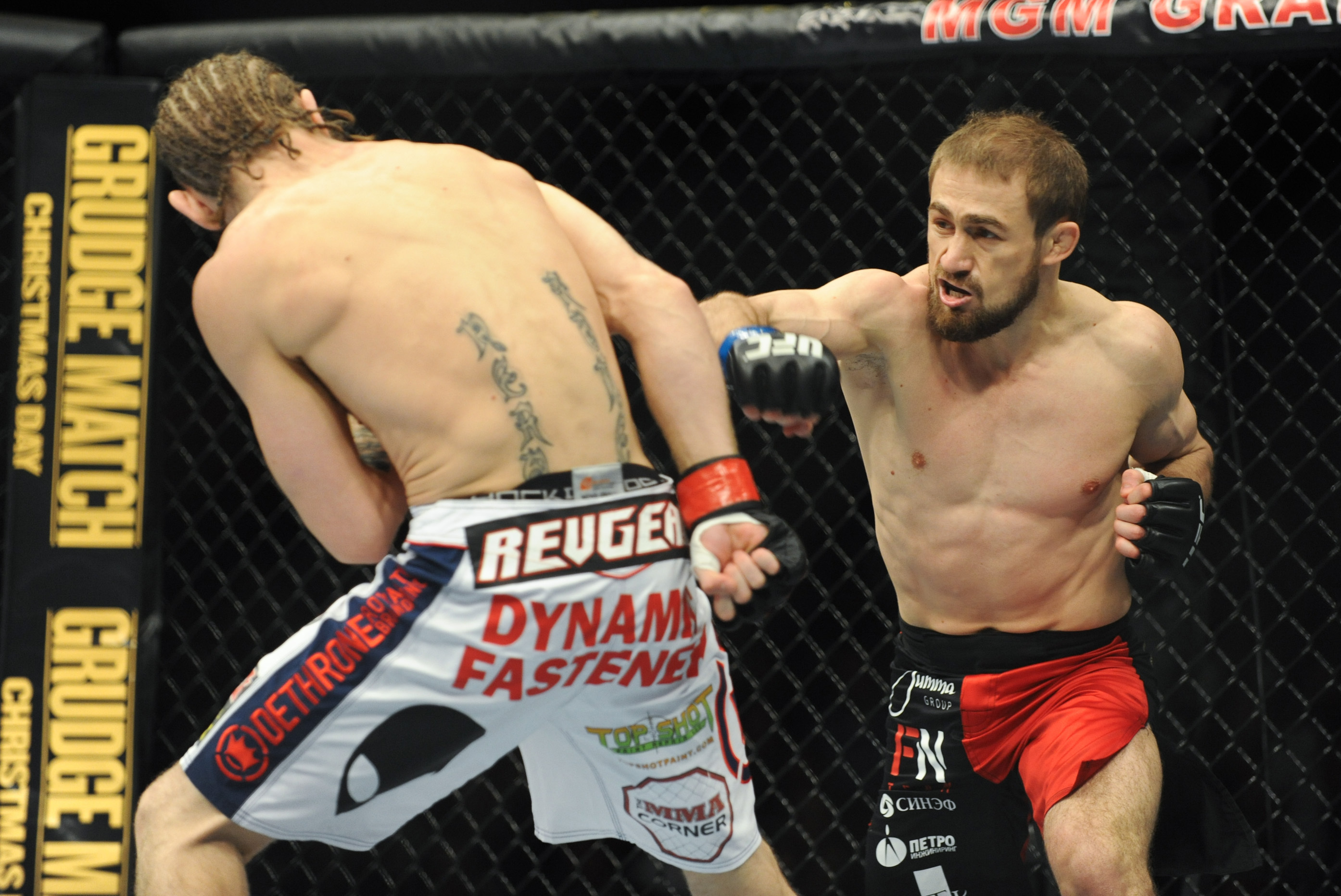 Nov 16, 2013; Las Vegas, NV, USA; Tim Elliott (red gloves) fights against Ali Bagautinov (blue gloves) in their flyweight bout during UFC 167 at MGM Grand Garden Arena. Mandatory Credit: Stephen R. Sylvanie-USA TODAY Sports
