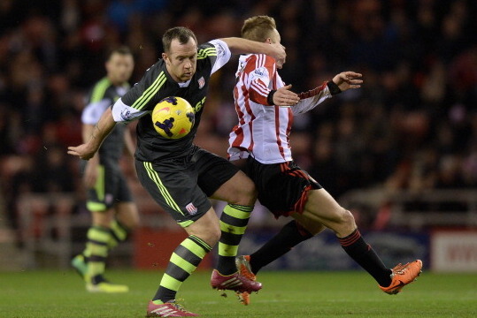 SUNDERLAND, ENGLAND - JANUARY 29:  Charlie Adam of Stoke City is tackled by Sebastian Larsson of Sunderland during the Premier League match between Sunderland and Stoke City at Stadium of Light on January 29, 2014 in Sunderland, England.  (Photo by Gareth