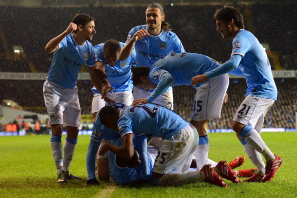 LONDON, ENGLAND - JANUARY 29:  Yaya Toure of Manchester City celebrates scoring their second goal from the penalty spot with his team mates during the Barclays Premier League match between Tottenham Hotspur and Manchester City at White Hart Lane on Januar