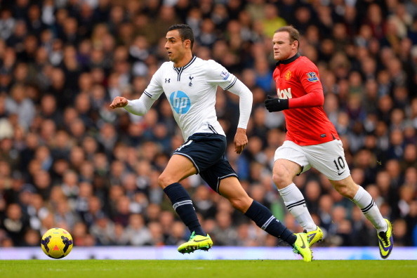 LONDON, ENGLAND - DECEMBER 01:  Wayne Rooney of Manchester United tracks Nacer Chadli of Tottenham Hotspur during the Barclays Premier League Match between Tottenham Hotspur and Manchester United at White Hart Lane on December 1, 2013 in London, England. 