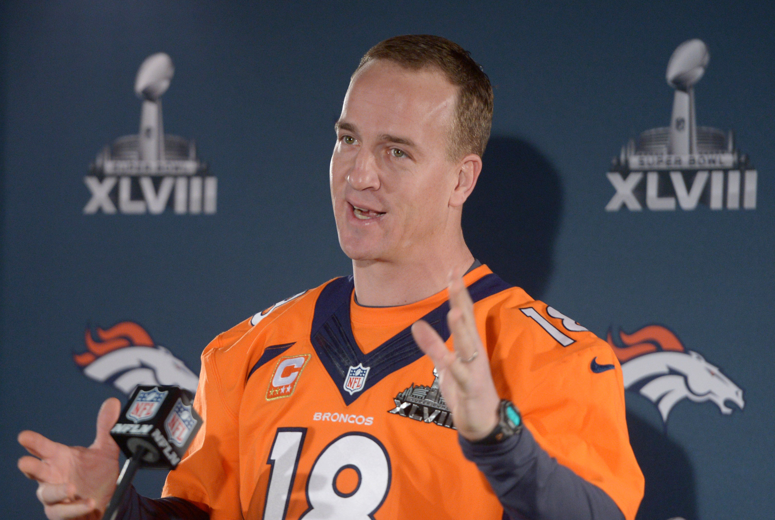 Jan 30, 2014; Jersey City, NJ, USA; Denver Broncos quarterback Peyton Manning (18) at a press conference in advance of Super Bowl XLVIII on the Cornucopia Majesty yacht on the Hudson River. Mandatory Credit: Kirby Lee-USA TODAY Sports