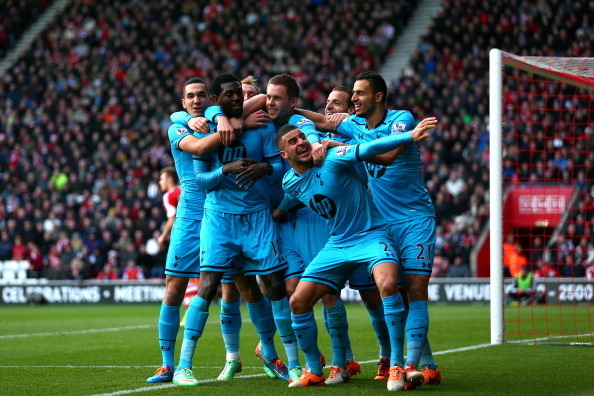 SOUTHAMPTON, ENGLAND - DECEMBER 22:  Emmanuel  Adebayor (2nd L) of Spurs celebrates with teammates after scoring his team's third goal during the Barclays Premier League match between Southampton and Tottenham Hotspur at St Mary's Stadium on December 22, 