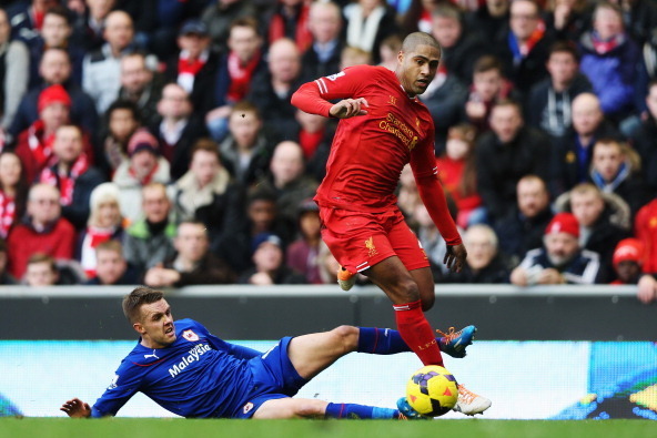 LIVERPOOL, ENGLAND - DECEMBER 21:  Glen Johnson (R) of Liverpool is tackled by Craig Noone (L) of Cardiff City during the Barclays Premier League match between Liverpool and Cardiff City at Anfield on December 21, 2013 in Liverpool, England.  (Photo by Cl