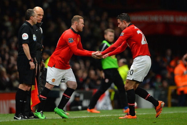 MANCHESTER, ENGLAND - JANUARY 28:  Wayne Rooney of Manchester United replaces Robin van Persie during the Barclays Premier League match between Manchester United and Cardiff City at Old Trafford on January 28, 2014 in Manchester, England.  (Photo by Micha