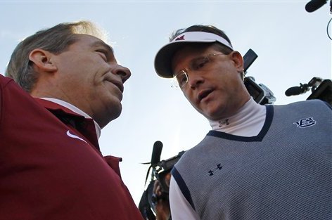 Alabama head coach Nick Saban (left) and Auburn head coach Gus Malzahn