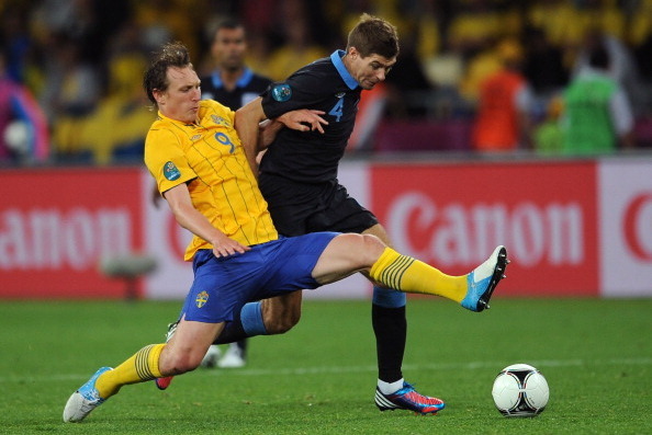 KIEV, UKRAINE - JUNE 15:  Kim Kallstrom of Sweden and Steven Gerrard of England battle for the ball during the UEFA EURO 2012 group D match between Sweden and England at The Olympic Stadium on June 15, 2012 in Kiev, Ukraine.  (Photo by Christopher Lee/Get