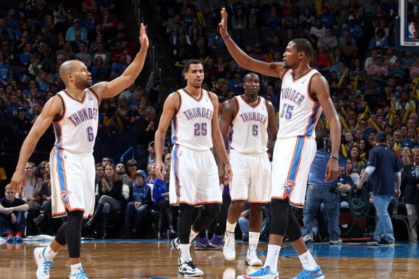 OKLAHOMA CITY, OK - JANUARY 19:  Derek Fisher #6 of the Oklahoma City Thunder, Kevin Durant #35 of the Oklahoma City Thunder celebrate after a play during an NBA game on January 19, 2014 at the Chesapeake Energy Arena in Oklahoma City, Oklahoma. NOTE TO U