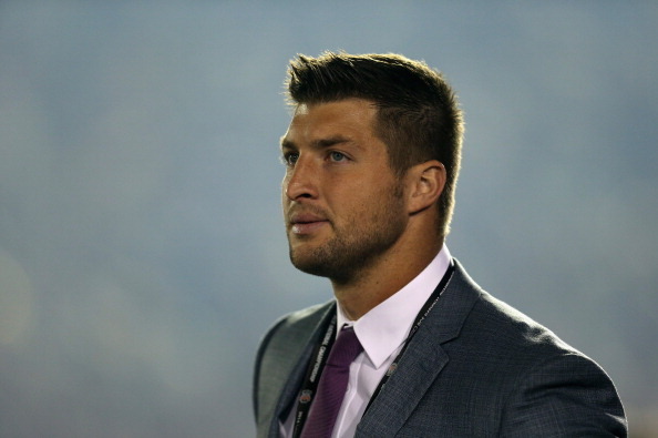 PASADENA, CA - JANUARY 06:  ESPN analyst Tim Tebow looks on during the 2014 Vizio BCS National Championship Game between the Florida State Seminoles and the Auburn Tigers at the Rose Bowl on January 6, 2014 in Pasadena, California.  (Photo by Jeff Gross/G