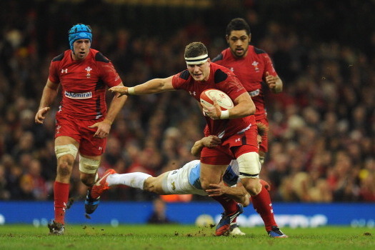 CARDIFF, WALES - NOVEMBER 16:  Wales player Scott Williams breaks a tackle during the International Match between Wales and Argentina at the Millennium Stadium on November 16, 2013 in Cardiff, Wales.  (Photo by Stu Forster/Getty Images)