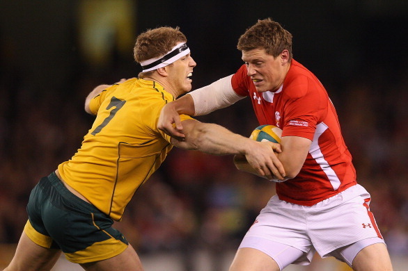 MELBOURNE, AUSTRALIA - JUNE 16:  Rhys Priestland of Wales is tackled by David Pocock of the Wallabies during the International Test Match between the Australian Wallabies and Wales at Etihad Stadium on June 16, 2012 in Melbourne, Australia.  (Photo by Qui