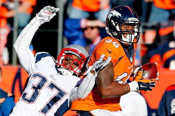 DENVER, CO - JANUARY 19:  Demaryius Thomas #88 of the Denver Broncos completes a fourth quarter reception against  Alfonzo Dennard #37 of the New England Patriots during the AFC Championship game at Sports Authority Field at Mile High on January 19, 2014