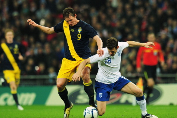 LONDON, ENGLAND - NOVEMBER 15:  Kim Kallstrom of Sweden (L) tangles with James Milner of England during the international friendly match between England and Sweden at Wembley Stadium on November 15, 2011 in London, England.  (Photo by Shaun Botterill/Gett