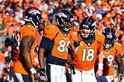 Jan 19, 2014; Denver, CO, USA; Denver Broncos quarterback Peyton Manning (18) talks to tight end Julius Thomas (80) and wide receiver Demaryius Thomas (88) against the New England Patriots during the 2013 AFC Championship football game at Sports Authority