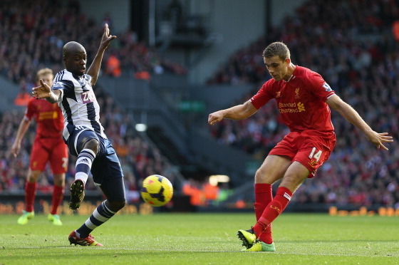 LIVERPOOL, ENGLAND - OCTOBER 26:  Jordan Henderson of Liverpool competes with Youssouf Mulumbu of West Bromwich Albion during the Barclays Premier League match between Liverpool and West Bromwich Albion at Anfield on October 26, 2013 in Liverpool, England