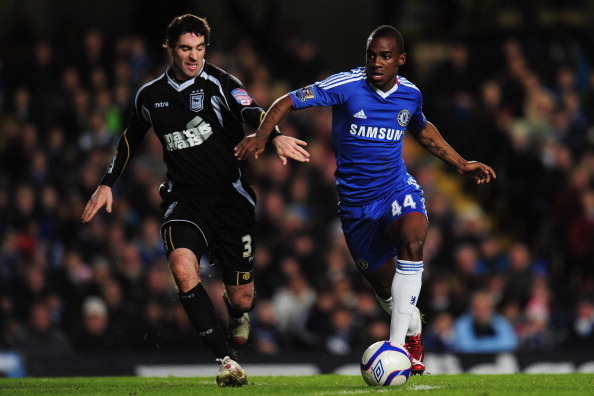 LONDON, ENGLAND - JANUARY 09:  Gael Kakuta of Chelsea holds off Mark Kennedy of Ipswich Town during the FA Cup sponsored by E.ON 3rd round match between Chelsea and Ipswich Town at Stamford Bridge on January 9, 2011 in London, England.  (Photo by Shaun Bo