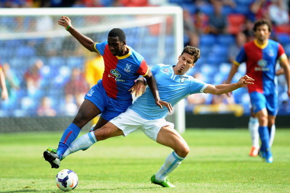 LONDON, ENGLAND - AUGUST 10:  Yannick Bolasie of Palace battles with Hernanes of Lazio during a Pre Season Friendly between Crystal Palace and Lazio at Selhurst Park on August 10, 2013 in London, England. (Photo by Christopher Lee/Getty Images)