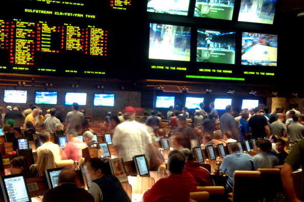 LAS VEGAS - MARCH 19: In this handout provided by the Las Vegas News Bureau, the Mirage Resort Race and Sports Book in Las Vegas is shown crowded with basketball fans during NCAA March Madness Tournament March 19, 2010. in Las Vegas, Nevada.  (Photo by Gl